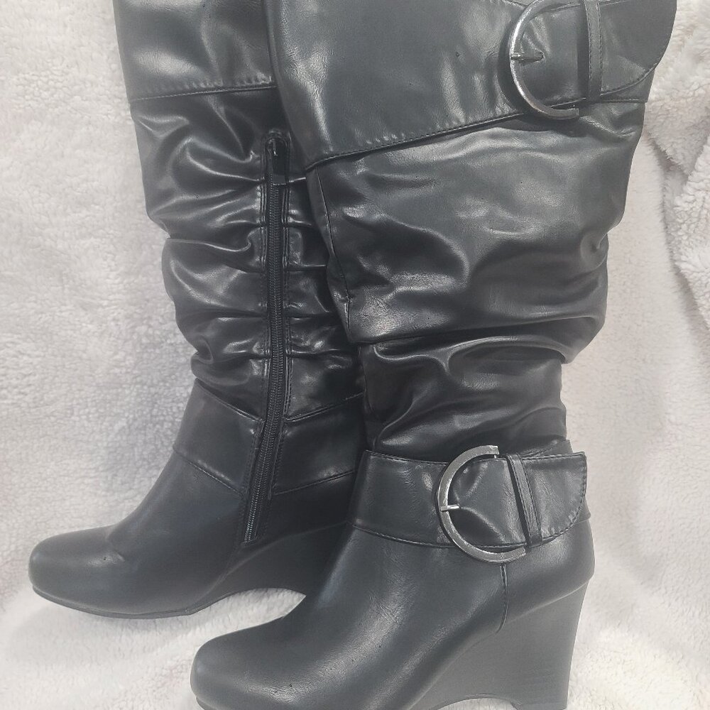 Knee high boots,  partial zipper on ins of boots.